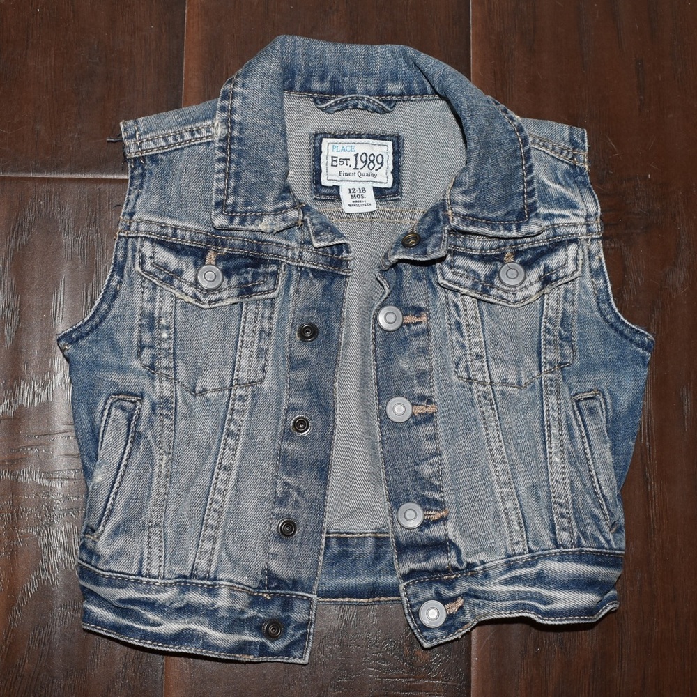Distressed denim vest